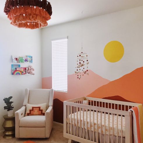 Magic Mountains Nursery with painted bright mural of mountains and sun