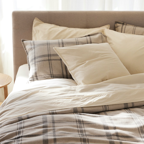 Cream of the Crop Zara Home Flannel Quilt and Throw Pillow cover with contrast check print stacked against a white background