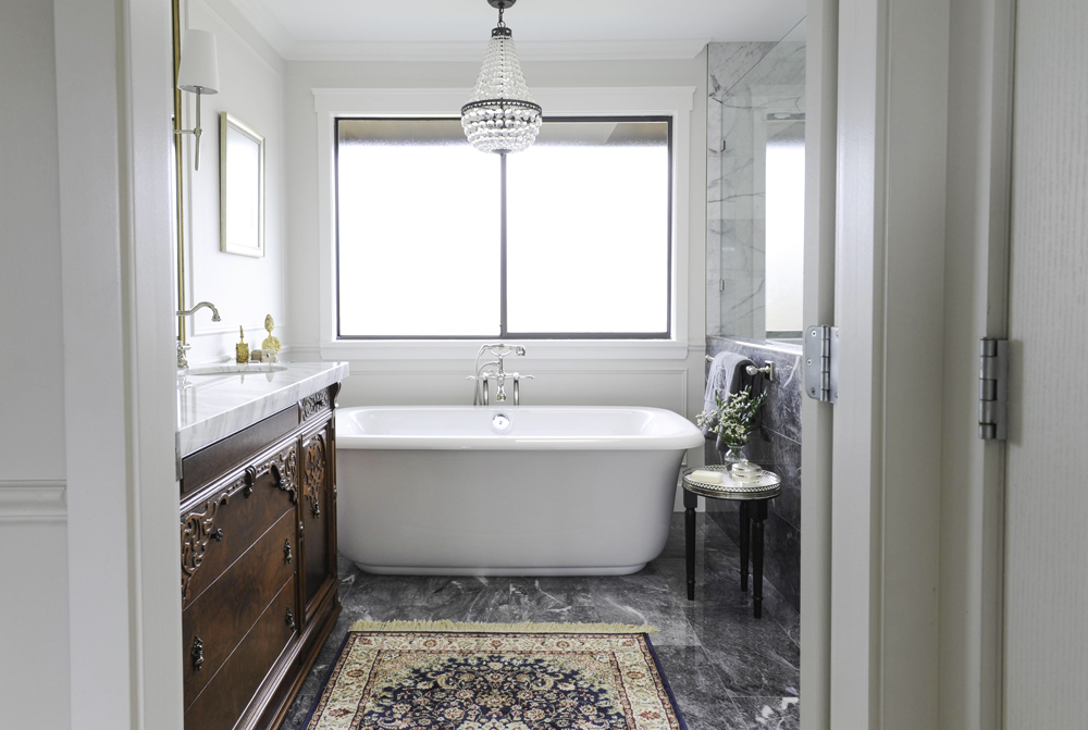 Layer in a Traditional Rug This Persian-style rug speaks to the bathroom's vintage vibe.