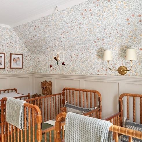 Timeless for Two Nursery with two vintage wooden cribs and apple orchard wallpaper