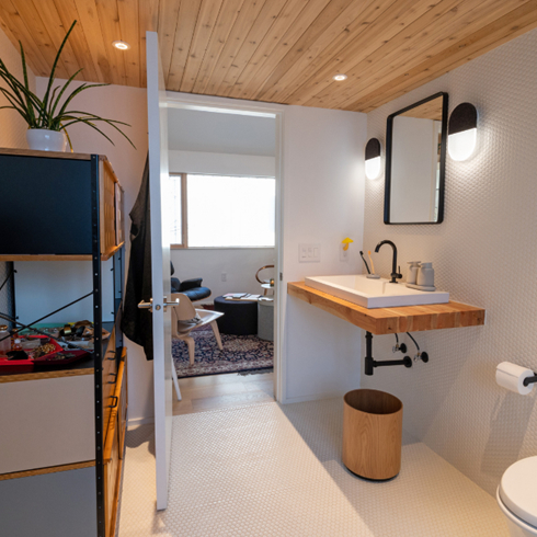 A Limited Palette: Simple Yet Versatile A spa-like stone and wooden bathroom