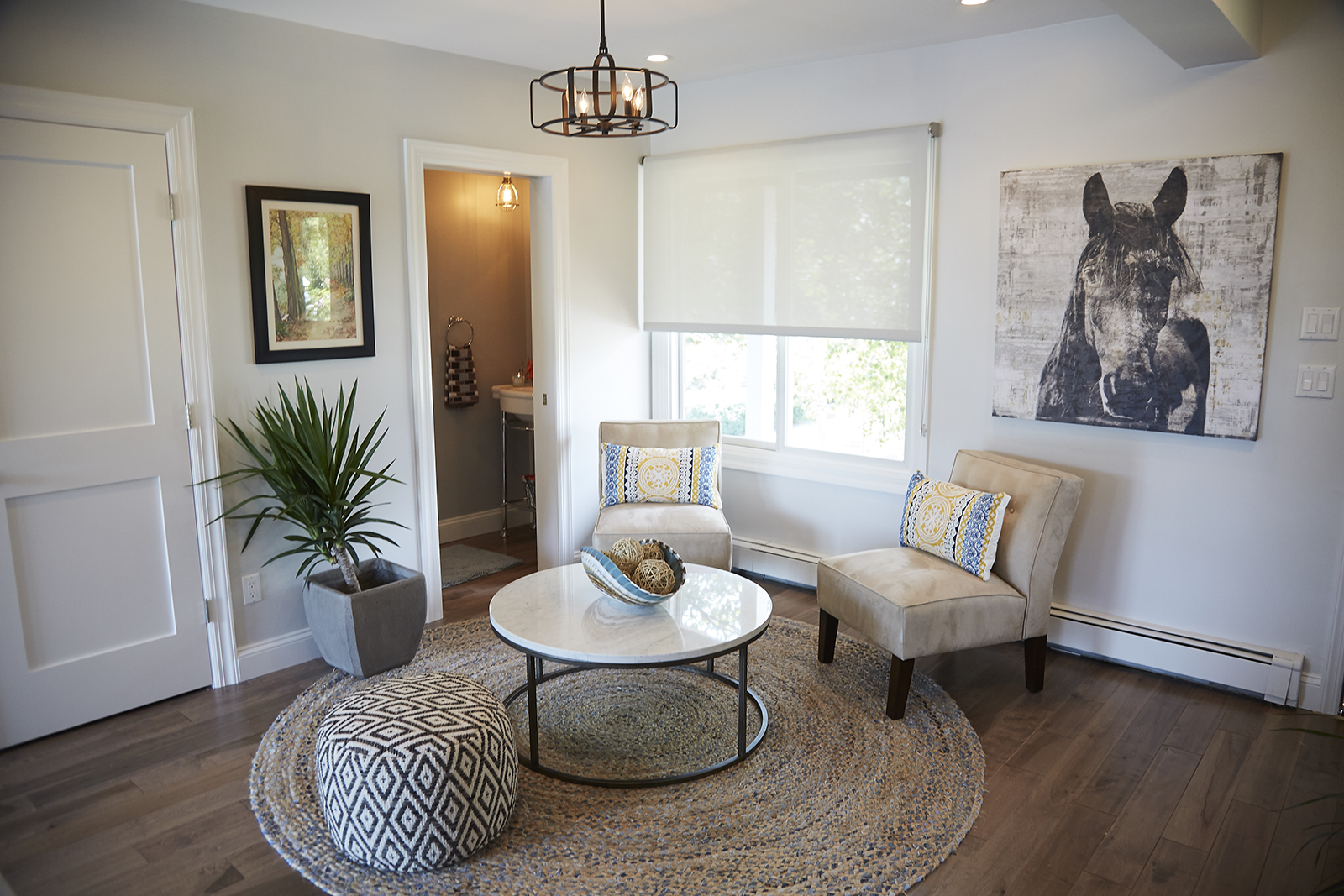 Seating Plan room with two slip chairs and horsehead painting