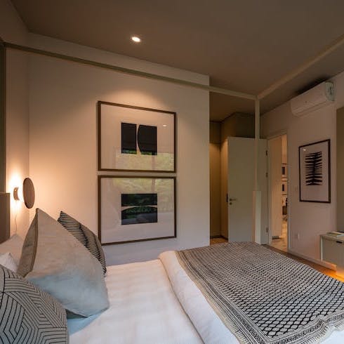 Cozy Ceilings A cozy bedroom with a white bed and a grey ceiling