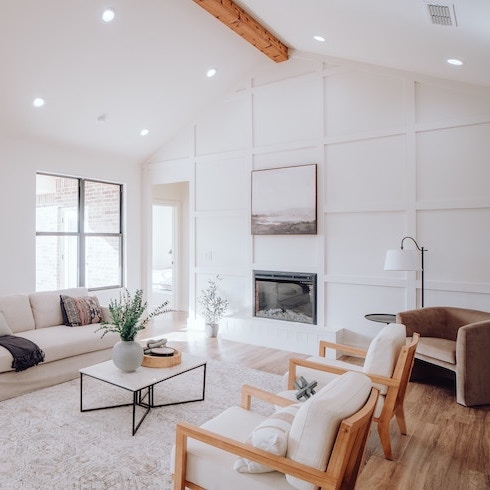 Energy-Efficient Upgrades A spacious white living room with windows on one wall
