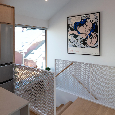 Clean Lines Galore The hallway with white walls and interesting artwork