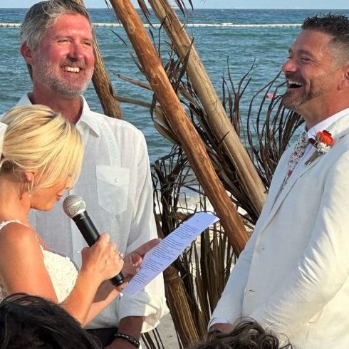 Kortney and Ryan Wrote Their Vows Kortney speaking into a mic at the alter
