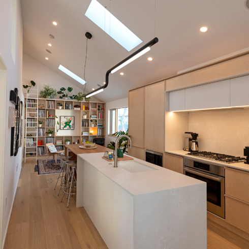 Flow With Ease The open kitchen with white island