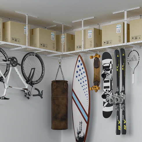 4. On High Fleximounts Overhead Garage Storage system on a white walled corner with boxes , bikes and sport equipment hanging from it as part of Home Network The Secret to Storing Holiday Decorations in Small Spaces