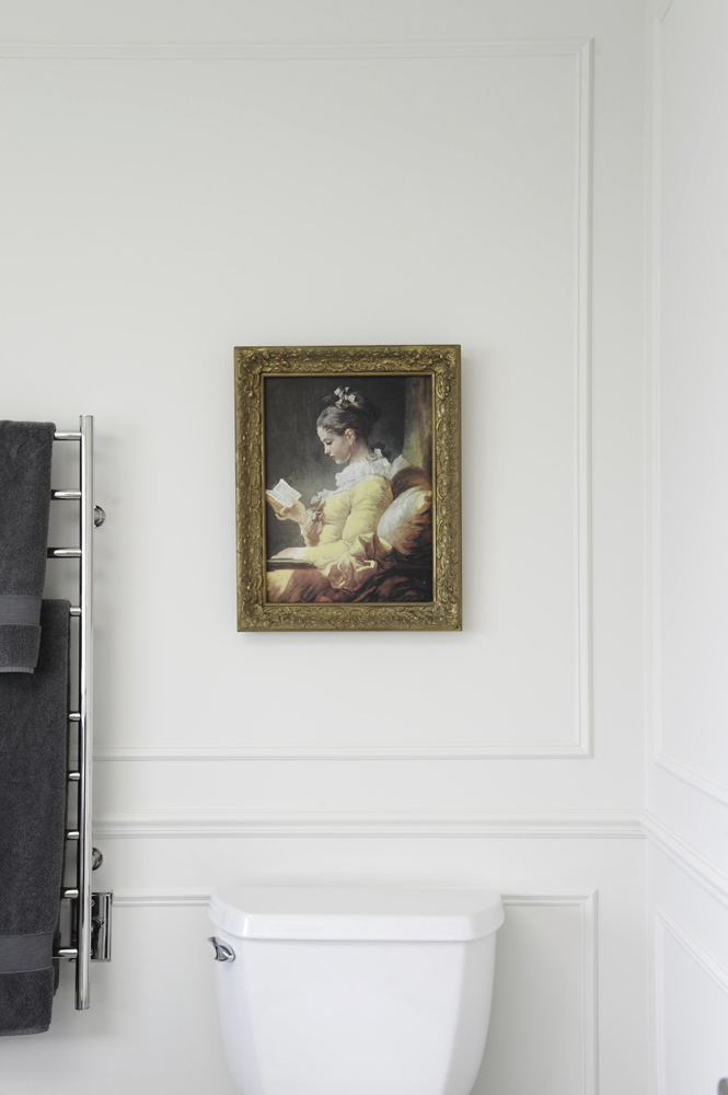 Include Old-World Art Old-world art adds warmth and character to this bathroom