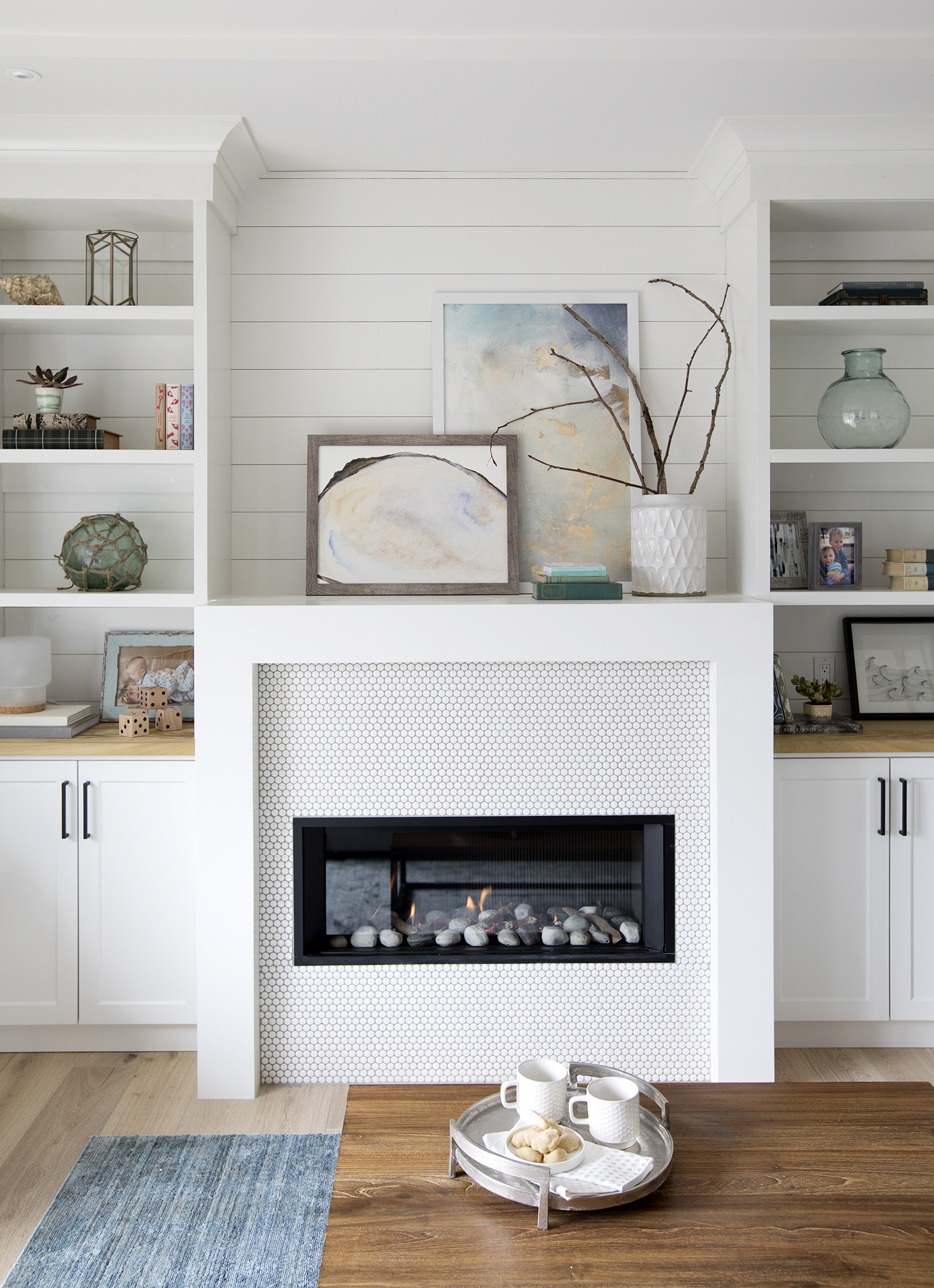 Penny Power shiplap treatment in the living room is the backdrop to a plethora of penny tiles on the fireplace.
