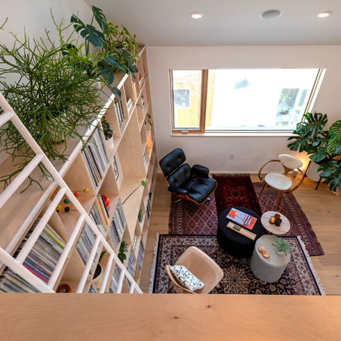 In-House Treehouse A shot from the loft space to the open living room below