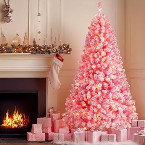 Glinda-Inspired Christmas Tree Pink Christmas tree beside fire place
