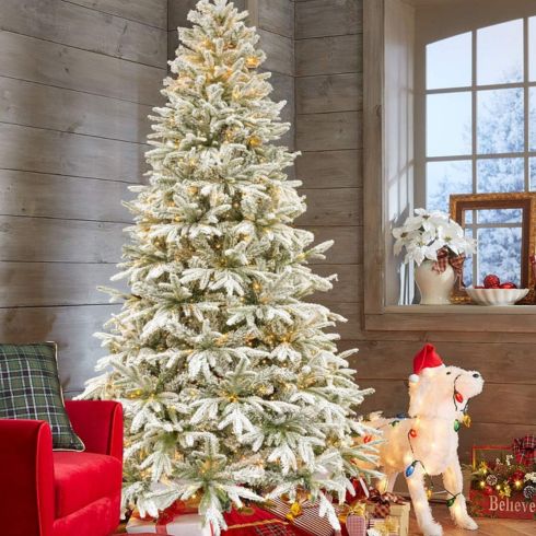 Winter Wonderland Christmas Tree White snow flocked Christmas tree in cottage
