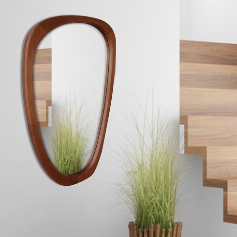 Asymmetrical Mirrors Wooden asymmetrical mirror on a living room wall.