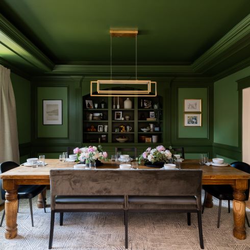 At-Home Entertaining Dining room painted green with long table