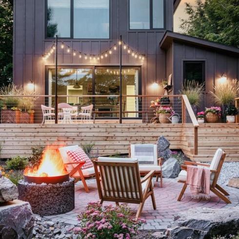 Backyard Entertainment Backyard for entertaining with fire pit and deck, and string lights
