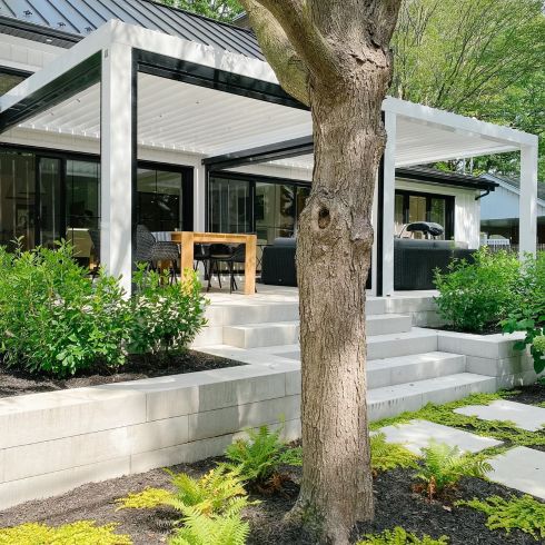 Level Up Elevated patio area in contemporary backyard