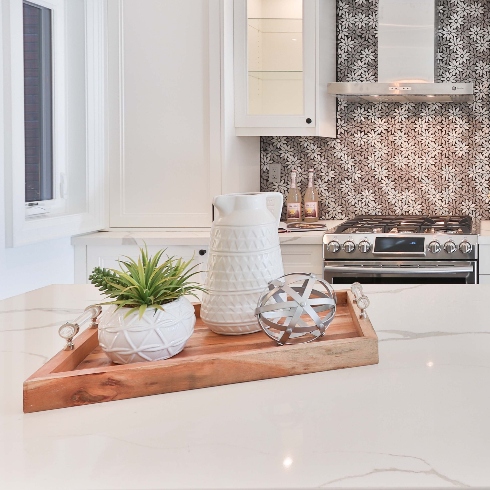 Kitchen Surfaces and Counters A marble countertop with decorative items on top