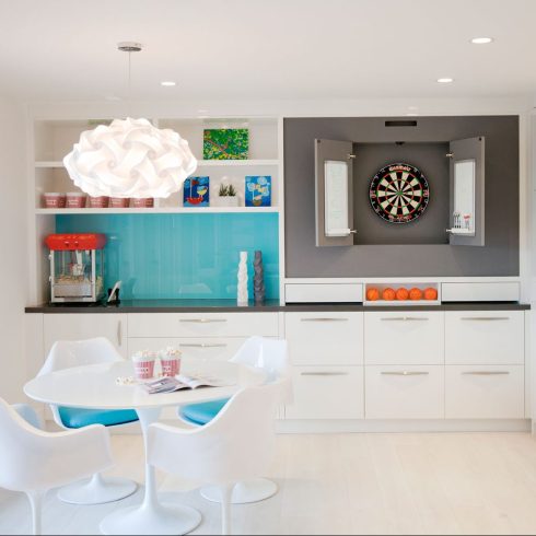 Chandeliers or Fancy Light Fixtures Unique chandelier hanging over the dinner table in a white basement kitchen