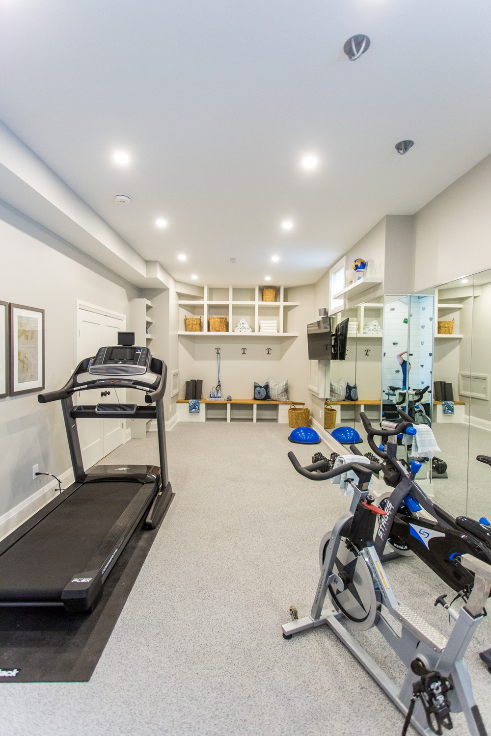 Storage Smarts Home gym with treadmill and bike