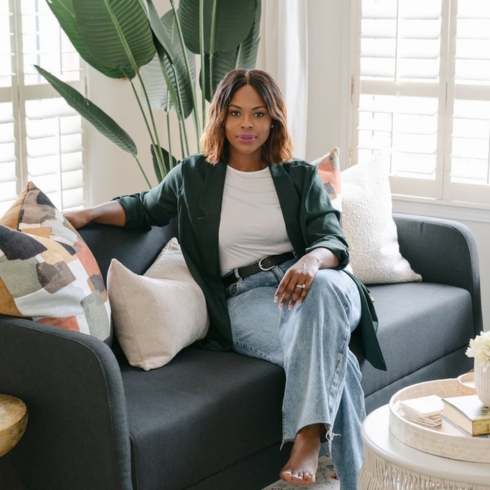 Brenda Danso Brenda Danso sitting on a couch