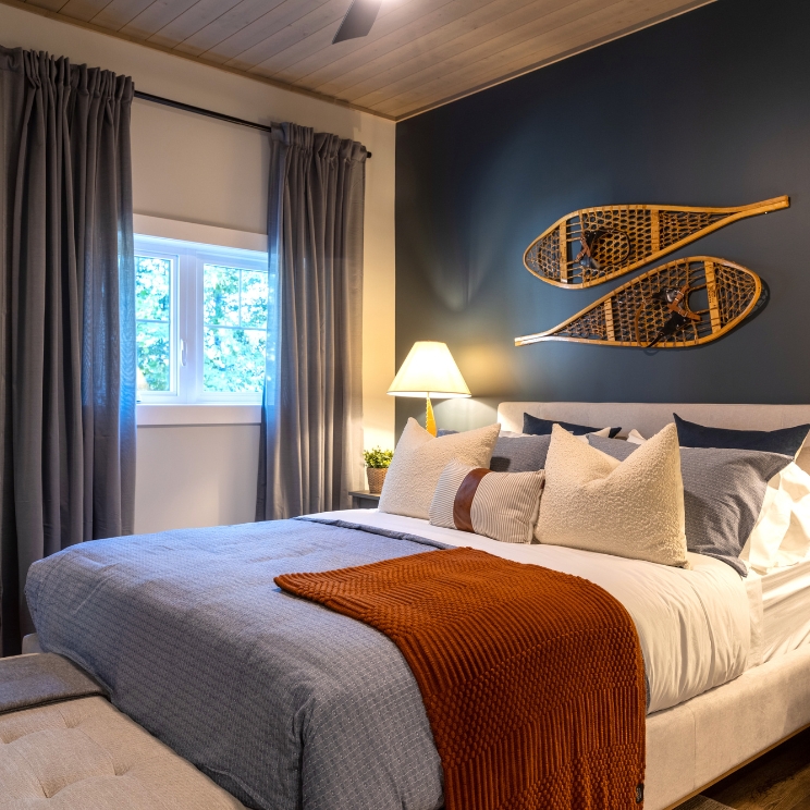 Winter Retreat Dark blue paint and snowshoes on wall
