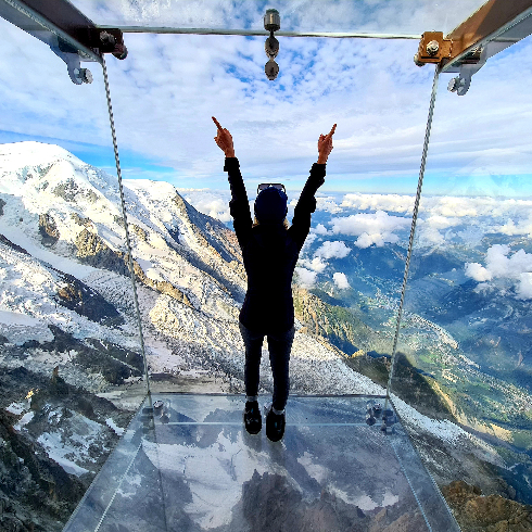 Chamonix-Mont-Blanc, France A woman standing on the Skywalk at the Chamonix-Mont-Blanc Ski Resort in France.