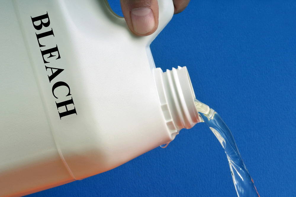 Bleach and Ammonia Person pouring bleach from a bottle