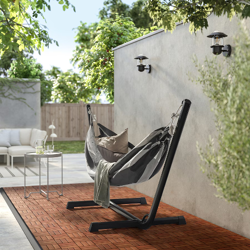 Swing Swing The Bockoen Hamnoen hammock from IKEA set up in an outdoor space