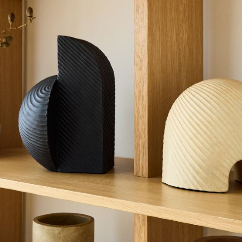 Scorpio (October 23-November 21): Ceramic Sculpture An off-white and black sculptural ceramic