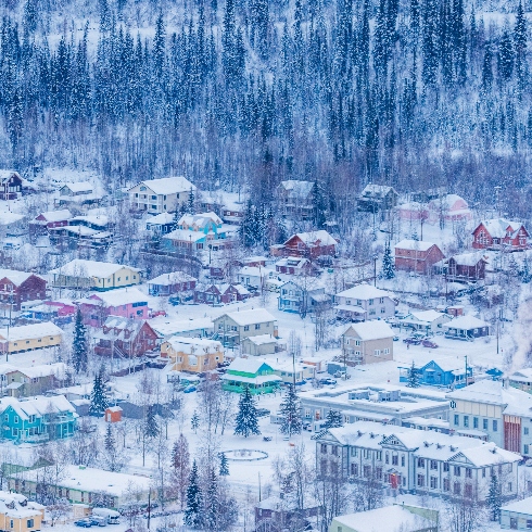 Dawson City, Yukon An aerial view of the colourful, snow-covered buildings in Dawson City, Yukon during the winter.