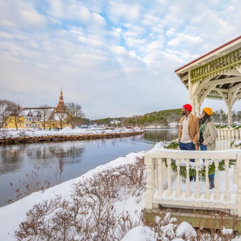 Mahone Bay, Nova Scotia A snowy Mahone Bay, Nova Scotia with a couple looking out at the water from a white gazebo.