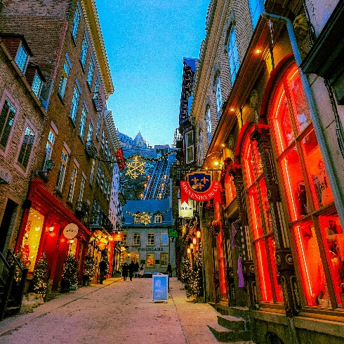 Québec City, Québec A street in Old Québec City during the winter with colourful lights in shop windows.