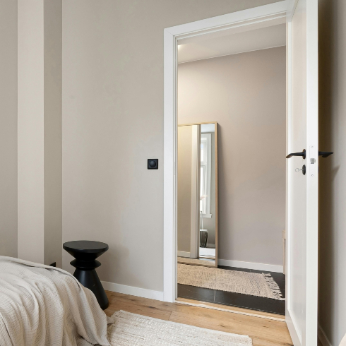 Door Frames and Knobs An image of a clean bedroom