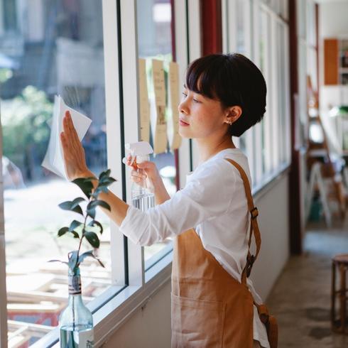 Get Innovative with Light Woman cleaning glass window