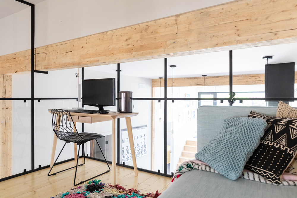 Design Your Desk View sleek desk in home office with glass walls