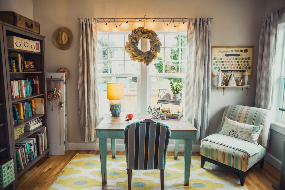 Maximize the Light cozy home office with string lights on window in front of desk