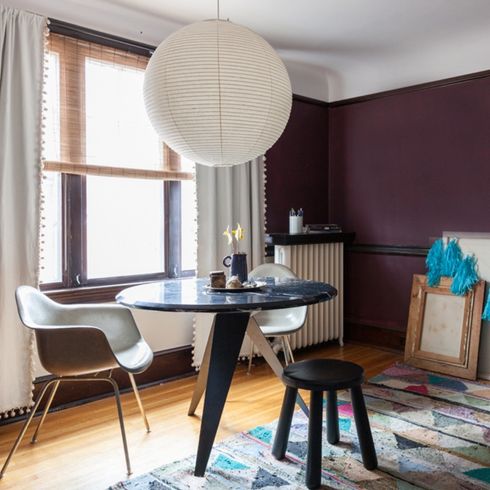 Dated Decor A breakfast nook with a dark accent wall