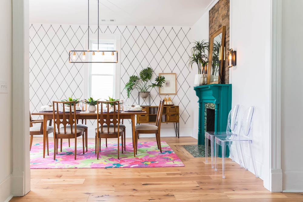 Paint a Pop of Bold Colour Dining room with colourful area rug and bright teal fireplace.