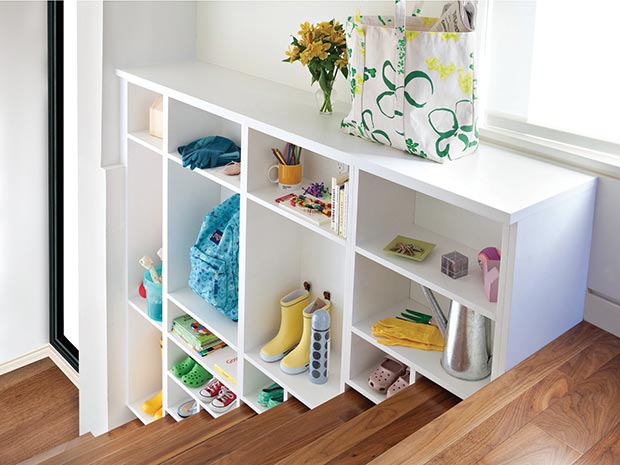 Opt for Creative Storage California closets shoe storage in white foyer