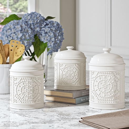 Clear the Kitchen Counter Three decorative white canisters arranged on a kitchen counter