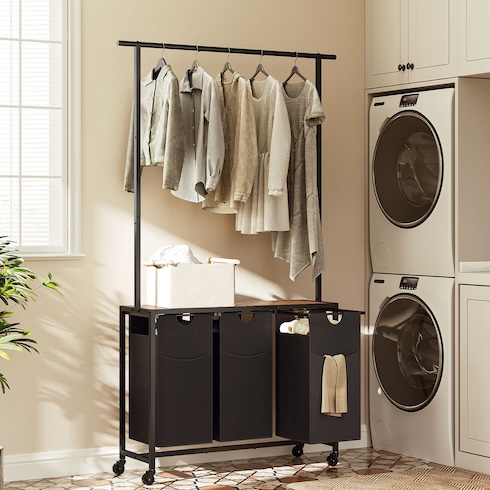 Level Up Laundry An assortment of clothes hang from hangers on a sleek laundry sorter rack in a laundry room.