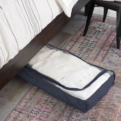 Look Under the Bed Assorted sweaters in a large under-the-bed storage bag.
