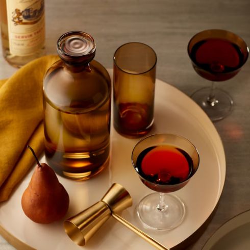 Amber Accents Amber glassware on white table with other cocktail accessories