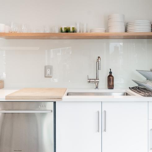 14. Use Your Dishwasher for Cleaning More Than Dishes a clean kitchen with white cabinets