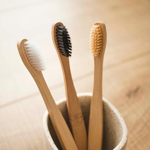 16. Clean Your Keyboard With a Toothbrush three bamboo toothbrushes