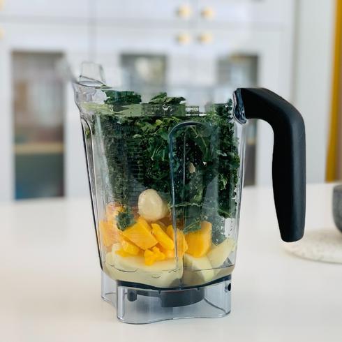20. The Easy Way to Clean a Blender a blender full of spinach and fruit