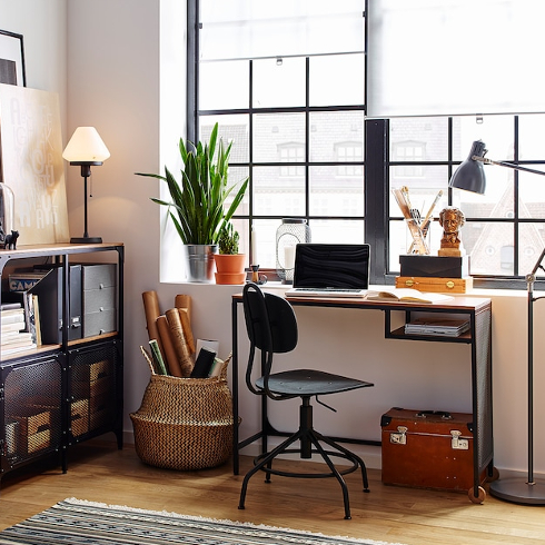 Industrial Chic A black metal and wooden laptop table in a chic industrial office