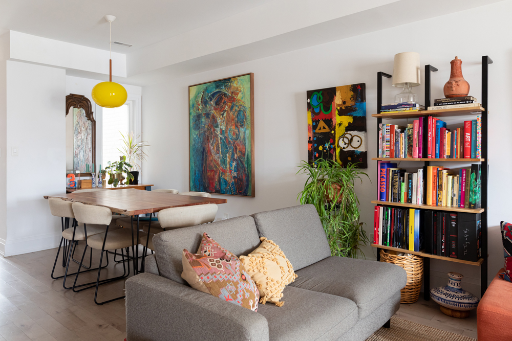 Perfect Paintings white open-concept living room and dining room with colourful paintings on the walls