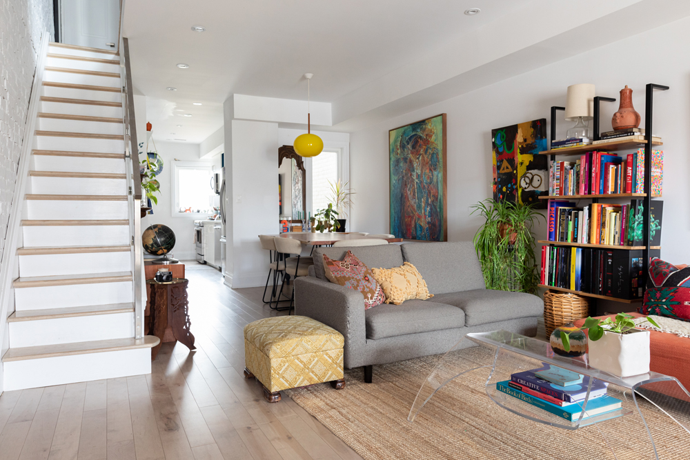 Light Bright White living room and dining room with colourful wall art
